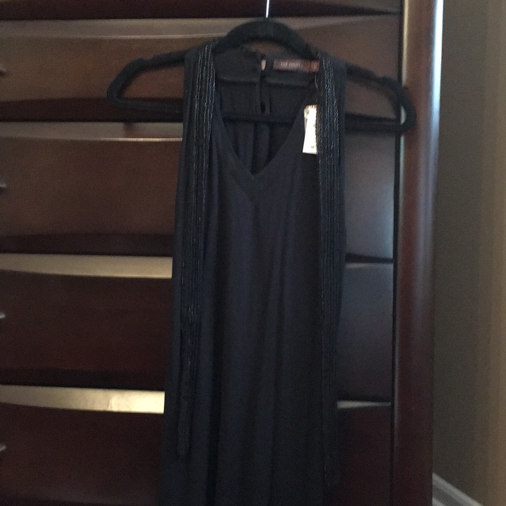 Limited black sleeveless top with beaded ties